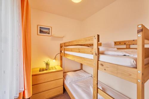 a bunk bed room with two bunk beds at Pension Valja in Janske Lazne