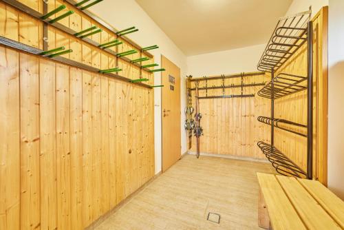 a large room with wooden walls and wooden flooring at Pension Valja in Janske Lazne