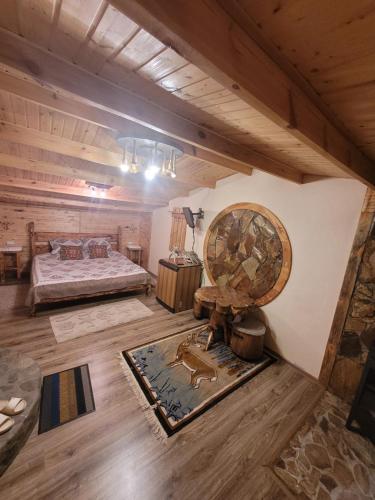 a large room with a bed and a mirror at Jashylkent House in Vorontsovskoye