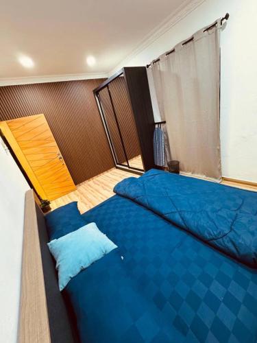 Postel nebo postele na pokoji v ubytování Ujang Guest House