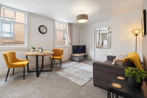 a living room with a couch and a table at WhiskAwayStays - Jenkins House - Apartment 1 in Worcester