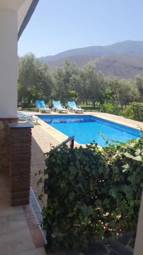 a view of a swimming pool from a house at Casa María in Órgiva