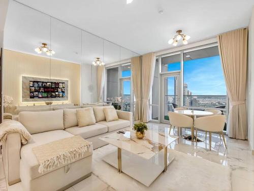 a living room with a white couch and a table at Luxury Apt in Business Bay Water canal view in Dubai