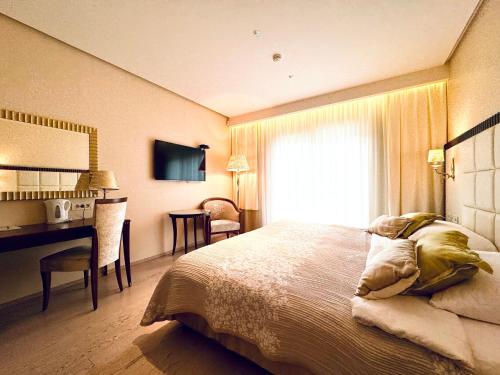 Postel nebo postele na pokoji v ubytování Boutique Hotel Oasi
