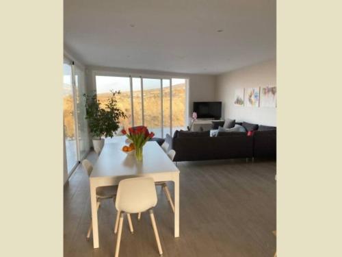 a living room with a table and a couch at Paraiso House in Callao Salvaje