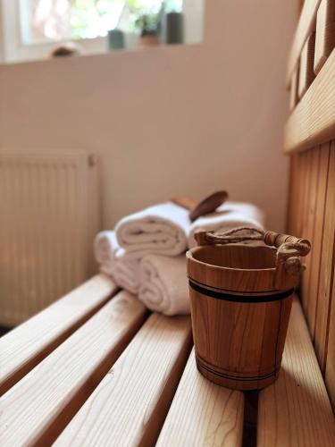 a room with some towels and a wooden barrel at Levendula Resort és Rendezvényközpont in Bogács