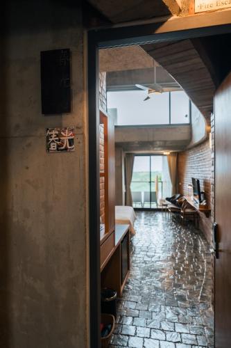 an open door to a room with a bedroom at The Light in Hengchun