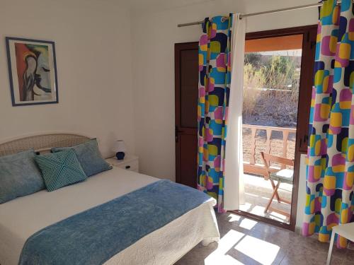 Postel nebo postele na pokoji v ubytování Casa Reyes Fataga