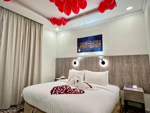 Katil atau katil-katil dalam bilik di Alayam Elite Hotel