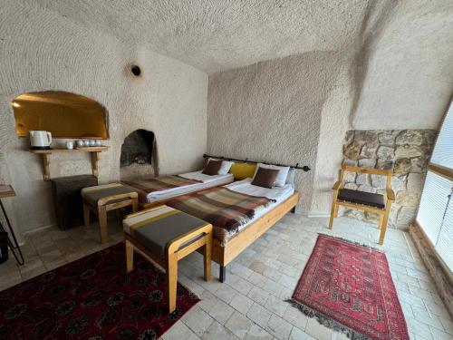 Pinhan Cave Suitesにあるベッド