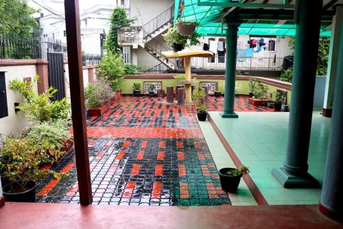 arium of a building with a patio with plants at Relax Breath - Ratnapura in Ratnapura