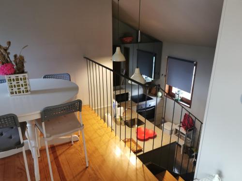a living room with a table and a dining room at Casa do Bairro da Veiga in Pereiro