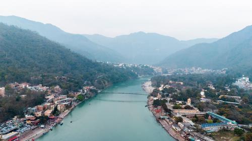 an aerial view of a city next to a river at Qcent Woods Resort & Spa, Rishikesh in Rishīkesh