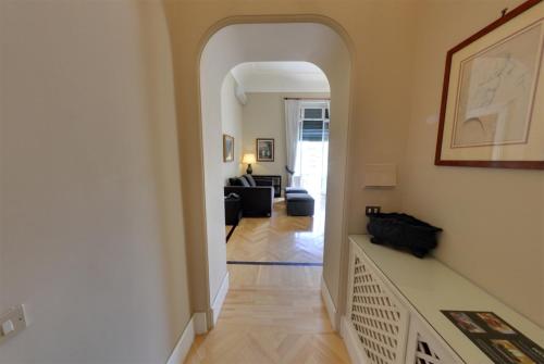 a hallway with an archway and a living room at Casa Rubinacci in Naples