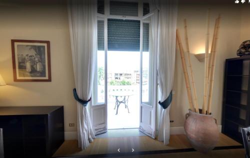 a room with a door open to a patio at Casa Rubinacci in Naples