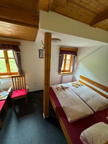Postel nebo postele na pokoji v ubytování bouda Pod Sněžkou