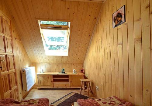 a room with a sink and a window in a cabin at Domki ogrzewane Sokół in Władysławowo