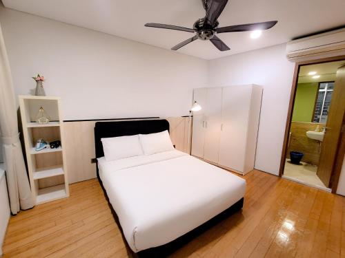 Un ou plusieurs lits dans un hébergement de l'établissement Vortex klcc suites