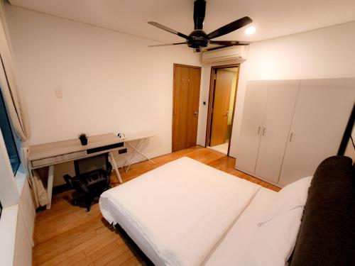 Un ou plusieurs lits dans un hébergement de l'établissement Vortex klcc suites