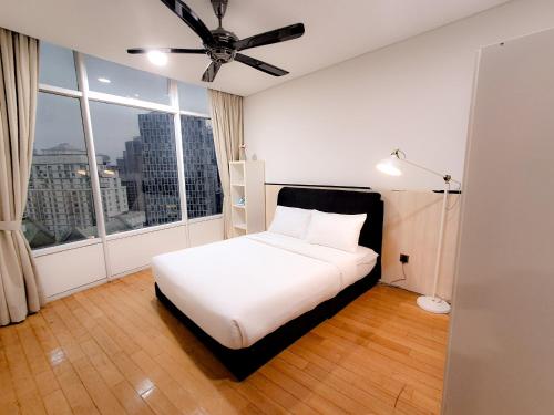 Un ou plusieurs lits dans un hébergement de l'établissement Vortex klcc suites