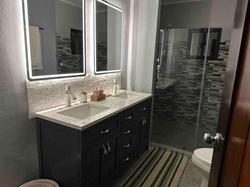 a bathroom with a sink and a shower at River Farm Stay near beach w Fiber Optic and Netflix in Botolan