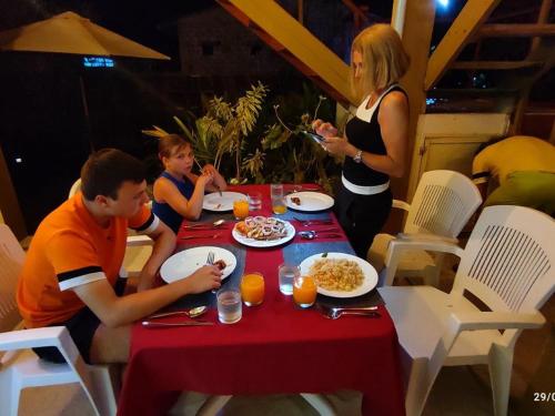 a group of people sitting at a table eating food at Rindali - The speedboat from Malé to the hotel departs at 1130 every Monday Thursday and Saturday and from the hotel to Malé at 0630 and five domestic flights are available every day in Dhaalu Atoll