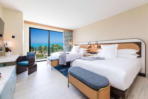 Postel nebo postele na pokoji v ubytování Wyndham Grand Rio Mar Rainforest Beach and Golf Resort