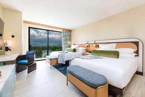 Postel nebo postele na pokoji v ubytování Wyndham Grand Rio Mar Rainforest Beach and Golf Resort