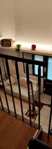 a room with a shelf with a bunch of pillows at Gemme Fiorentine Apartments in front of the train station 5 minutes from the centre Free parking in Florence