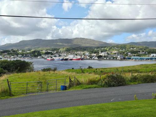 a view of a river with boats in the water at Benroe House 5 Bedrooms in Killybegs