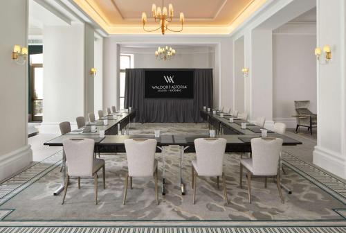 a meeting room with a long table and chairs at Waldorf Astoria Atlanta Buckhead in Atlanta