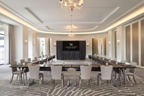 a conference room with a long table and chairs at Waldorf Astoria Atlanta Buckhead in Atlanta