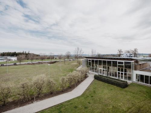 an aerial view of a building with a park at Spa Resort Geinberg in Geinberg