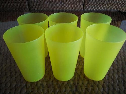 four green cups sitting on top of a table at Hua Hin Blue Lagoon in Cha Am