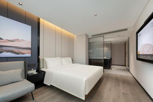 Μια τηλεόραση ή/και κέντρο ψυχαγωγίας στο Atour Hotel Guangzhou Nansha UNI MALL