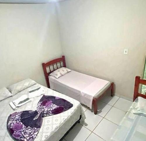 Ένα ή περισσότερα κρεβάτια σε δωμάτιο στο Pousada São Martins