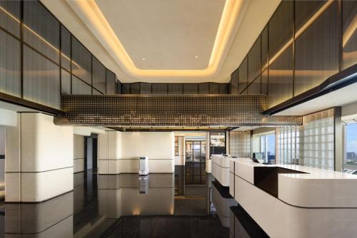 Ο χώρος του λόμπι ή της ρεσεψιόν στο Atour Hotel Guangzhou Nansha UNI MALL