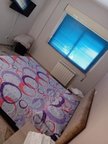 a bedroom with a bed and a window at San vito 9 in Agrigento
