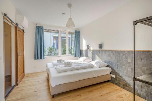 a bedroom with a bed in a room at Landgoed Leudal in Haelen
