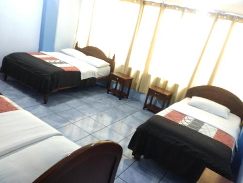 Postel nebo postele na pokoji v ubytování Hostal mariajose baños