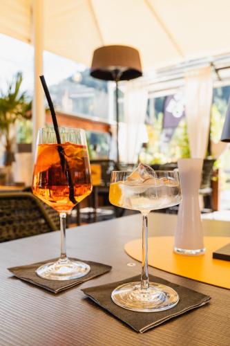 two glasses of drinks sitting on a table at Schindler in Sankt Anton am Arlberg