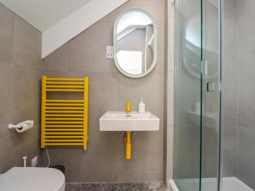 a bathroom with a sink and a mirror at Ocean View in Alnwick
