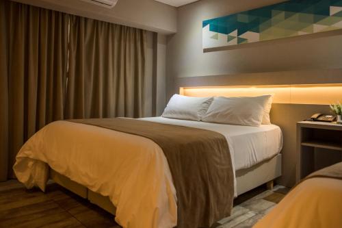 Postel nebo postele na pokoji v ubytování Eleton Resort & Spa