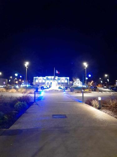 an empty parking lot at night with street lights at Perfect Gites In Normandy - New Beginnings Barn in Saint-Sauveur-de-Chaulieu