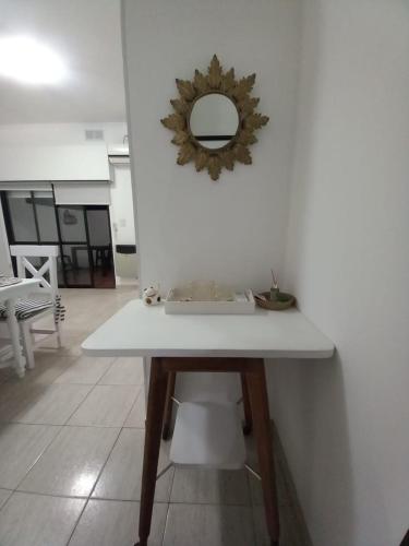 a white table with a mirror on the wall at Parque in Gualeguaychú