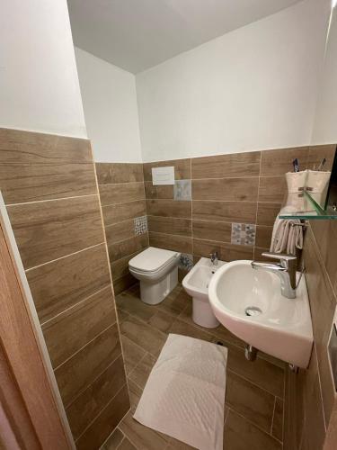 a bathroom with a sink and a toilet at Hotel Cortese in Palermo