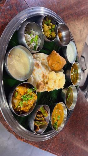 a plate of food with many different types of food at Varada nagavali hotel in Srīkākulam