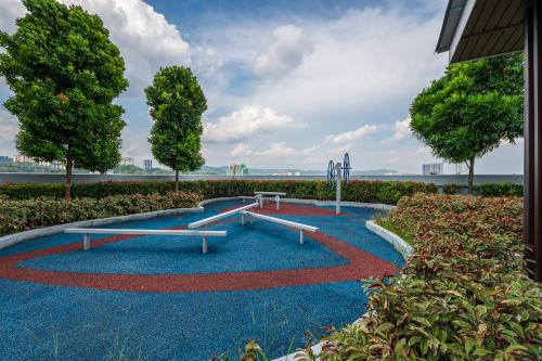 a park with two benches on a blue ground at Kuala Lumpur luxury MRT Suntex in Cheras