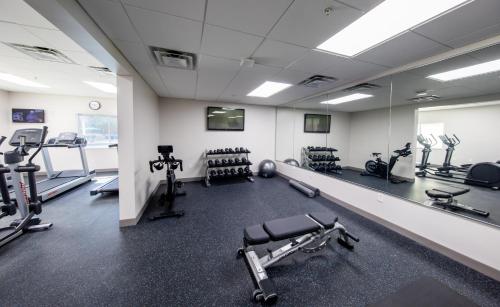 a gym with several treadmills and exercise machines at Holiday Inn Express & Suites Clermont SE - West Orlando by IHG in Orlando