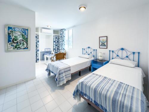 Ένα ή περισσότερα κρεβάτια σε δωμάτιο στο Villa Oasis Maspalomas